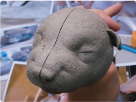 子犬の顔粘土彫刻